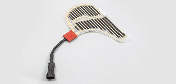 Polyester heater for contour heating with plug