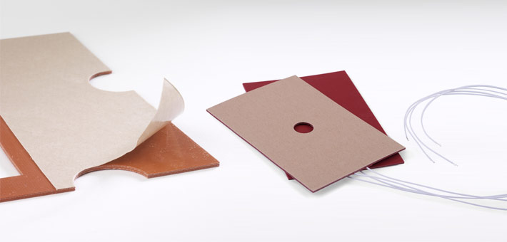 Silicone heaters with adhesive