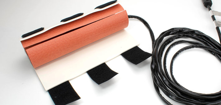 Silicone heater for a tube with silicone foam and velcro, open