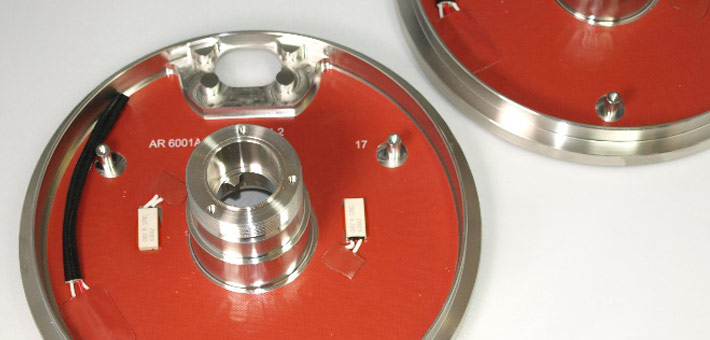 Silicone heater with limiter, vulcanised to free-issued part